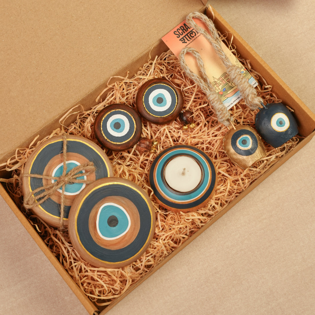 Divya Drishti Diwali Gift Hamper | Evil Eye Décor Set with Door Hangings, Coasters, Candle Stand & Bell Hangings | Sustainable & Handcrafted in Banaras